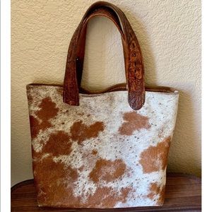 Cowhide and leather handbag
